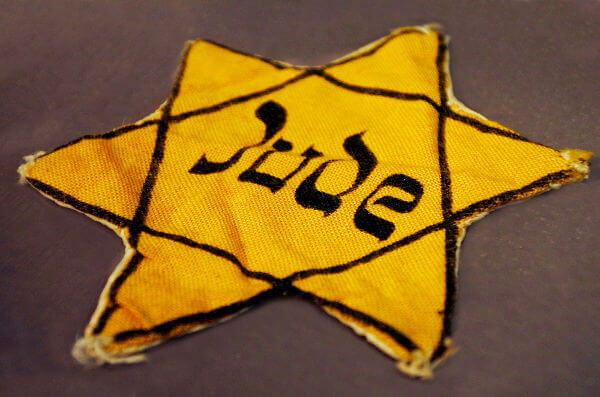 During the Holocaust years, the Nazis forced Jews to wear a star sewn onto their clothing as a form of identification.**