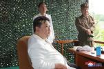 Kim Jong-un is photographed using a foldable cell phone; look